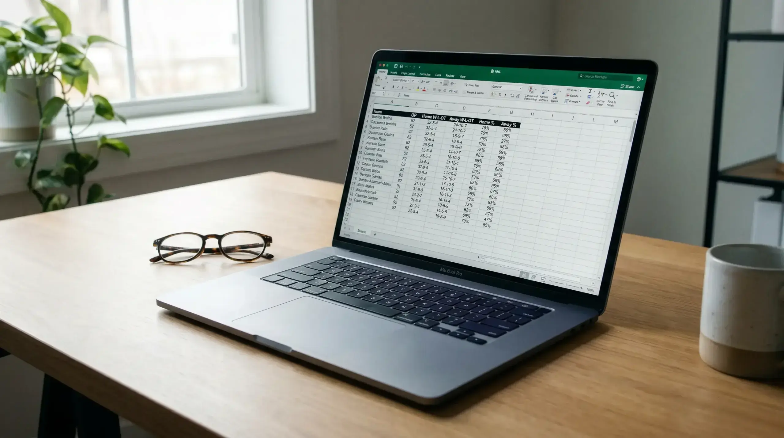 Laptop screen showing NHL home and away odds comparison data