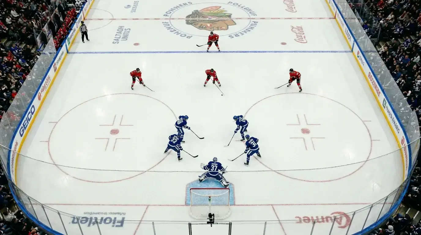NHL power play action with players positioned around the offensive zone